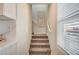 Staircase with carpet runner and neutral wall colors at 344 Banished Ave # 2, North Las Vegas, NV 89031