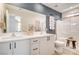 Modern bathroom with dual sinks, a shower/tub combo, and stylish decor at 344 Banished Ave # 3, North Las Vegas, NV 89031