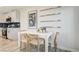 Kitchen dining area with white table and four cane chairs at 344 Banished Ave # 3, North Las Vegas, NV 89031