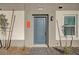 Modern home's front door with stone walkway at 344 Banished Ave # 3, North Las Vegas, NV 89031