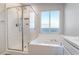 Clean bathroom with walk-in shower and soaking tub at 4008 W Le Baron Ave, Las Vegas, NV 89141