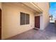 Private entrance with paved patio and brown door at 4008 W Le Baron Ave, Las Vegas, NV 89141