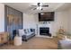 Living room featuring a fireplace, gray couch, and a large flat-screen TV at 436 Emden St, Henderson, NV 89015