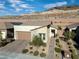 Single-story home with a two-car garage and landscaping at 44 Alta Cascata Pl, Henderson, NV 89011