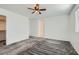 Bright bedroom with gray carpet, ceiling fan, and walk-in closet at 4672 Cactus Sun Ln, North Las Vegas, NV 89031