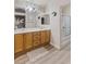 Bathroom with double vanity and wood cabinets at 6525 Raven Hall St, North Las Vegas, NV 89084