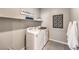 Laundry room with washer, dryer, and shelving at 7623 Phoenix Falls St # Lot 44, North Las Vegas, NV 89084