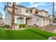 Two-story home with a three-car garage and attractive landscaping at 7900 Riviera Beach Dr, Las Vegas, NV 89128