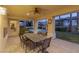 Evening view of covered patio with dining area and pool at 8109 Dark Hollow Pl, Las Vegas, NV 89117