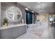 Elegant bathroom boasting double vanities, a freestanding tub, and large mirrors at 1096 Spirit Rock Dr, Henderson, NV 89012