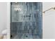 Stylish bathroom with blue tile shower and gold accents at 1236 S 8Th St, Las Vegas, NV 89104