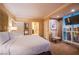 Spacious main bedroom with a king-size bed, sitting area, and city views at 125 E Harmon Ave # 2801 & 2803, Las Vegas, NV 89109