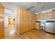 Spacious laundry room with ample cabinetry and kitchen view at 1261 S Comstock St, Pahrump, NV 89048