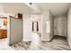 Open entryway with wood-look tile floors and views into the kitchen and living room at 1330 N Jones Blvd, Las Vegas, NV 89108