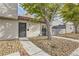 Updated stucco townhouse with a charming front entry and landscaped yard at 1330 N Jones Blvd, Las Vegas, NV 89108