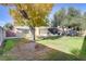 Large backyard with mature trees and bird bath at 1756 Del Almo Dr, Las Vegas, NV 89104