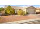 Front yard view of a one-story house with desert landscaping at 2135 Prevail Dr, North Las Vegas, NV 89032