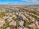 Aerial view of community near lake and mountain range at 2628 Starfish Ct, Las Vegas, NV 89128