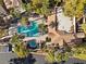 Aerial view of community pool, spa, and surrounding buildings at 2628 Starfish Ct, Las Vegas, NV 89128