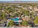 Aerial view of community pool and surrounding homes with mountain backdrop at 2628 Starfish Ct, Las Vegas, NV 89128