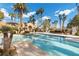 Sparkling community pool with palm trees at 2628 Starfish Ct, Las Vegas, NV 89128