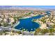 Aerial view of lakefront community and mountains at 2736 Crystal Beach Dr, Las Vegas, NV 89128