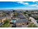 Aerial view showcasing a house with a private pool, nestled within a residential community at 3232 Pasolini Ct, North Las Vegas, NV 89032