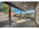 Covered patio with ceiling fan, overlooking the backyard at 3232 Pasolini Ct, North Las Vegas, NV 89032