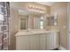 Bathroom with double vanity, large mirror and shower at 3232 Pasolini Ct, North Las Vegas, NV 89032