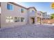 Large gravel backyard with view of house exterior at 3812 Lower Saxon Ave, North Las Vegas, NV 89085