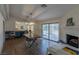 Dining area with hardwood floors, fireplace and view to kitchen at 3850 Pacific St, Las Vegas, NV 89121