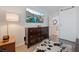 Bedroom with dresser, TV, and a cowhide rug at 409 Dairy Creek Ave, Las Vegas, NV 89183