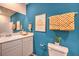 Modern bathroom with teal walls and white vanity at 4842 Currant Ridge Ave # 69, Las Vegas, NV 89141