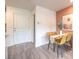 Bright dining area with modern table and chairs, stylish decor, and wood flooring at 4842 Currant Ridge Ave # 69, Las Vegas, NV 89141