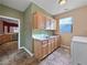 Laundry room with wood cabinets, sink, and washer/dryer hookups at 570 Long Iron Ln, Mesquite, NV 89027