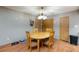 Dining area with wooden table and chairs, hardwood floors at 571 Fehrs Way, Pahrump, NV 89060