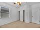 Bedroom with ceiling fan, closet, and neutral carpet at 765 Crest Valley Pl, Henderson, NV 89011