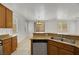 Kitchen with island, double sink, and modern appliances at 765 Crest Valley Pl, Henderson, NV 89011