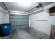 Attached garage with overhead door and extra storage space at 7972 W Nevso Dr, Las Vegas, NV 89147