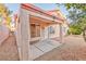 Covered patio with access to a desert landscape backyard at 8113 Painted Clay Ave, Las Vegas, NV 89128