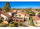 Elevated view of the home showcasing the backyard, solar panels, and surrounding neighborhood at 8229 Sedona Sunrise Dr, Las Vegas, NV 89128