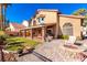 Backyard with patio, fire pit, and grassy area at 8229 Sedona Sunrise Dr, Las Vegas, NV 89128