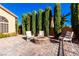 Backyard patio with fire pit and comfortable seating at 8229 Sedona Sunrise Dr, Las Vegas, NV 89128