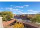 View of backyard with walking path and neighboring houses at 8647 Isla Vista Valley Ct, Las Vegas, NV 89178