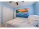 Bedroom with a mural and double closet at 8647 Isla Vista Valley Ct, Las Vegas, NV 89178