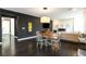 Dining area adjacent to living room with dark accent wall at 9660 Hiking Ave, Las Vegas, NV 89166