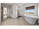 Spa-like bathroom with soaking tub and walk-in shower at 9872 Russian Hill St, Las Vegas, NV 89141