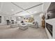 Bright and airy living room with fireplace and large windows at 9872 Russian Hill St, Las Vegas, NV 89141