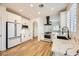 Modern kitchen with white cabinets, quartz countertops, and stainless steel appliances at 10282 Country Flats Ln, Las Vegas, NV 89135