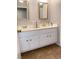 Double vanity bathroom with updated fixtures and an elegant mirror at 3690 S Rosecrest Cir, Las Vegas, NV 89121